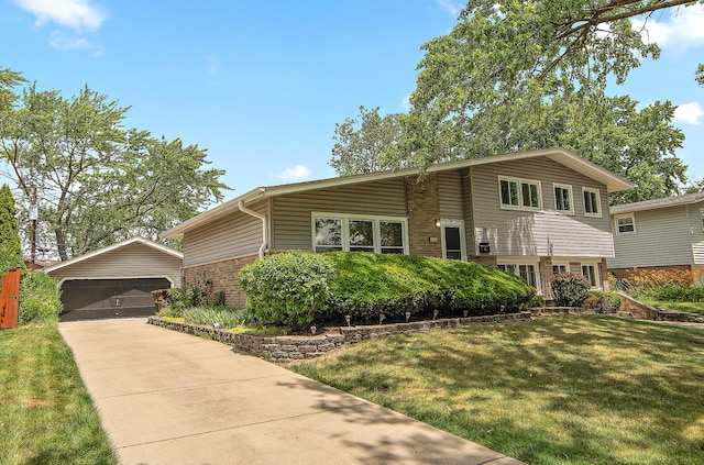 5754 150th St, Oak Forest, IL 60452 - split level home with an outbuilding, a front yard, brick siding, and a garage