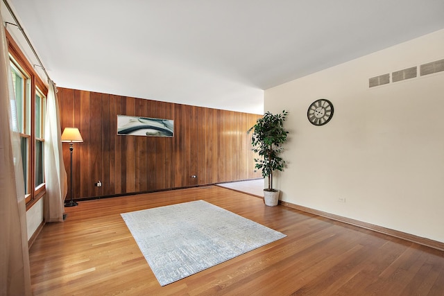 5754 150th St, Oak Forest, IL 60452 - unfurnished room with light wood-type flooring and wood walls