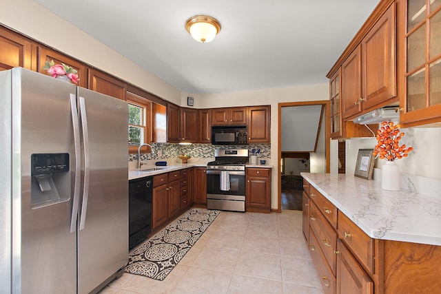 5754 150th St, Oak Forest, IL 60452 - kitchen featuring black appliances, decorative backsplash, glass insert cabinets, and brown cabinetry
