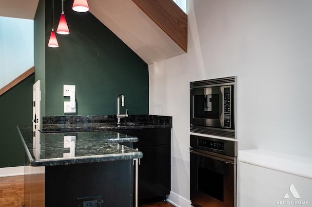 113 Oak Ridge Dr E, Burr Ridge, IL 60527 - kitchen featuring stainless steel appliances, pendant lighting, dark stone counters, and a peninsula