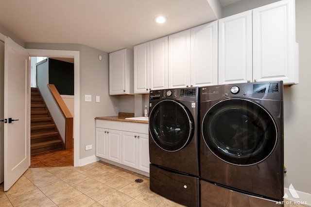 113 Oak Ridge Dr E, Burr Ridge, IL 60527 - laundry area with washing machine and dryer, cabinet space, recessed lighting, and light tile patterned floors