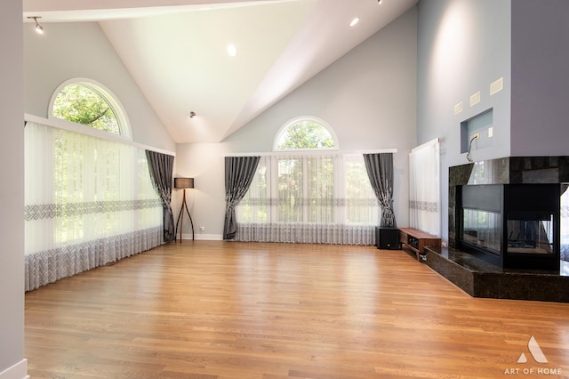 113 Oak Ridge Dr E, Burr Ridge, IL 60527 - unfurnished living room featuring high vaulted ceiling, wood finished floors, and a fireplace