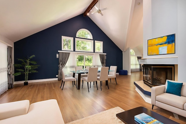 113 Oak Ridge Dr E, Burr Ridge, IL 60527 - living room featuring high vaulted ceiling, wood finished floors, a ceiling fan, beam ceiling, and a multi sided fireplace