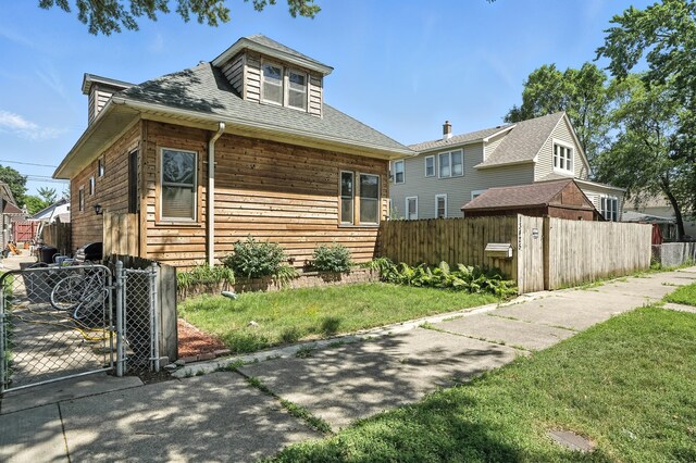 13425 S S Ave M, Chicago, IL 60633 - bungalow-style house featuring a gate and roof with shingles