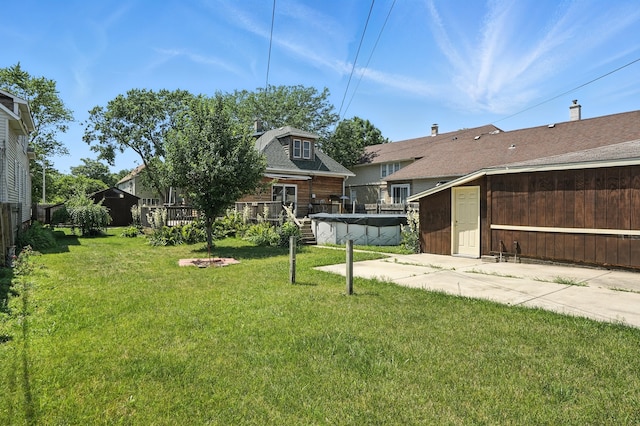 13425 S S Ave M, Chicago, IL 60633 - view of grassy yard featuring a wooden deck and a storage unit