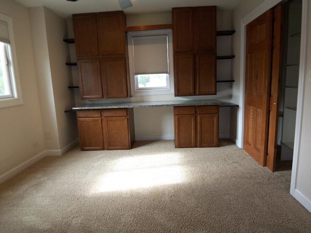 623 Willow Ln, Elk Grove Village, IL 60007 - kitchen with open shelves, built in study area, and light colored carpet