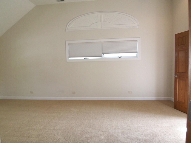 623 Willow Ln, Elk Grove Village, IL 60007 - carpeted empty room featuring lofted ceiling and baseboards