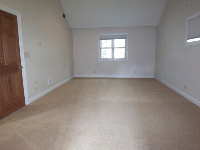 623 Willow Ln, Elk Grove Village, IL 60007 - unfurnished room featuring vaulted ceiling and light colored carpet