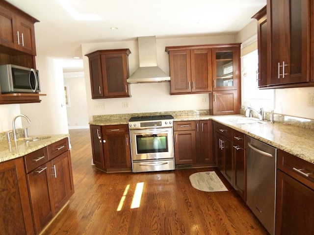 623 Willow Ln, Elk Grove Village, IL 60007 - kitchen featuring appliances with stainless steel finishes, wall chimney range hood, dark wood-style floors, light stone countertops, and recessed lighting