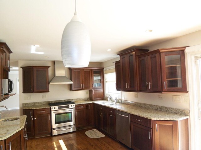 623 Willow Ln, Elk Grove Village, IL 60007 - kitchen with wall chimney exhaust hood, appliances with stainless steel finishes, glass insert cabinets, light stone counters, and dark wood finished floors