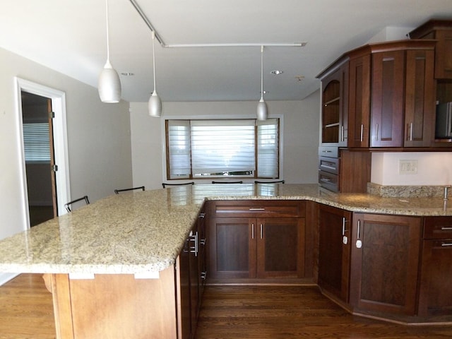 623 Willow Ln, Elk Grove Village, IL 60007 - kitchen featuring dark wood-style flooring, a peninsula, light stone countertops, and hanging light fixtures