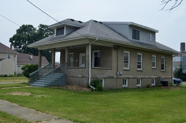 12005 4th St, Huntley, IL 60142 - bungalow-style home with a front yard, brick siding, roof with shingles, and a porch