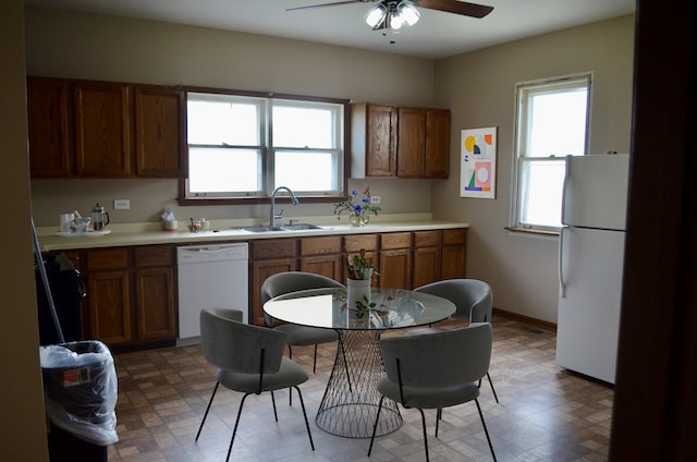 12005 4th St, Huntley, IL 60142 - kitchen with white appliances, a ceiling fan, brown cabinets, and light countertops