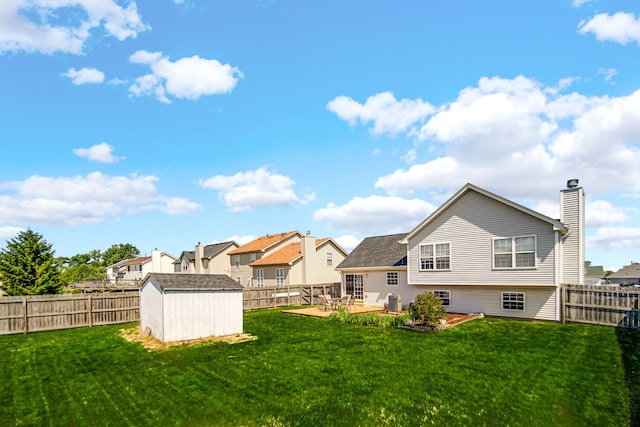 4513 W Jonquil Ln, Monee, IL 60449 - rear view of property with a storage unit, a fenced backyard, and a patio