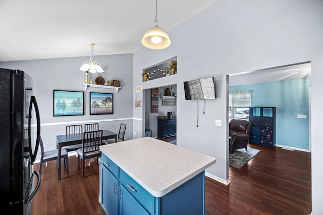 4513 W Jonquil Ln, Monee, IL 60449 - kitchen featuring freestanding refrigerator, blue cabinetry, dark wood-type flooring, light countertops, and a kitchen island