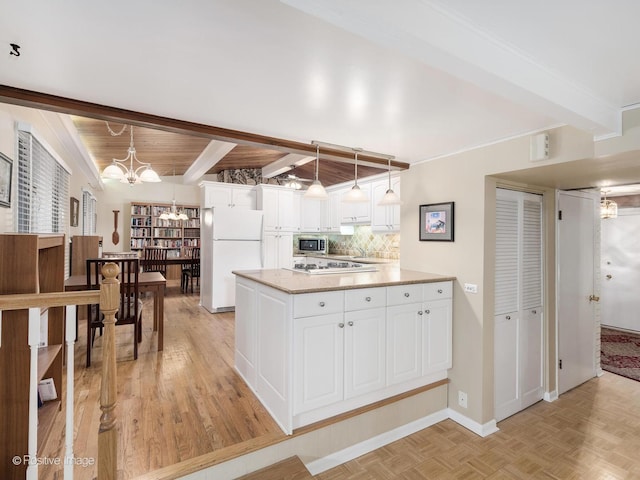 3843 Lizette Ln, Glenview, IL 60026 - kitchen featuring white appliances, beam ceiling, white cabinets, tasteful backsplash, and a peninsula