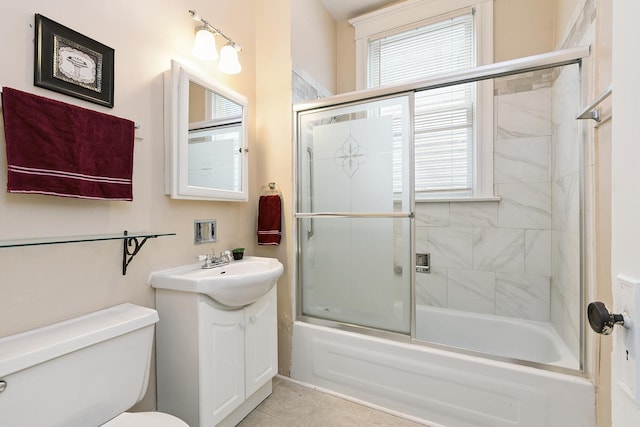 7933 S Burnham Ave, Chicago, IL 60617 - bathroom featuring healthy amount of natural light, vanity, shower / bath combination with glass door, and tile patterned floors