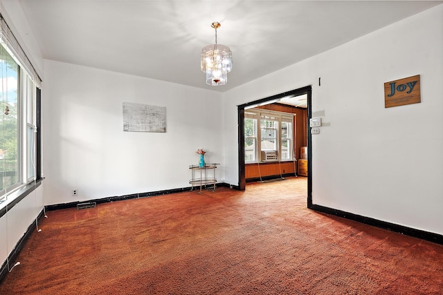 7933 S Burnham Ave, Chicago, IL 60617 - unfurnished room featuring carpet, a chandelier, and cooling unit