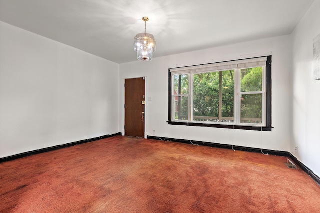 7933 S Burnham Ave, Chicago, IL 60617 - spare room with carpet and a chandelier