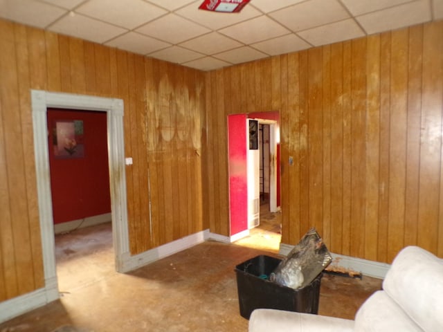 8417 S Mackinaw Ave, Chicago, IL 60617 - living area with wood walls and a drop ceiling