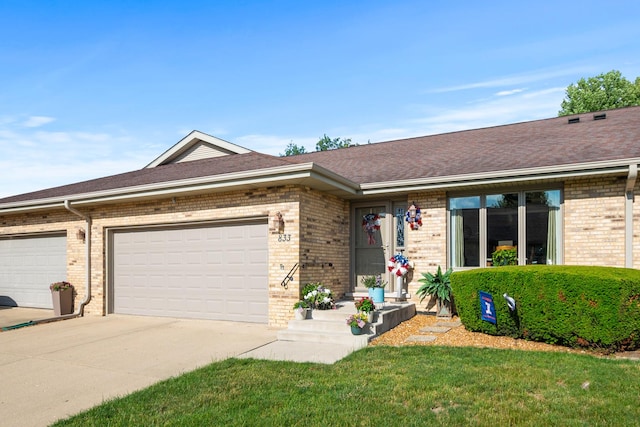 833 Winter Park Dr Unit 833, New Lenox, IL 60451 - view of front of house featuring brick siding, concrete driveway, roof with shingles, a front lawn, and a garage
