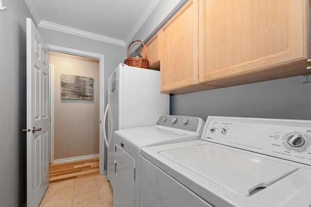 833 Winter Park Dr Unit 833, New Lenox, IL 60451 - washroom with ornamental molding, washer and clothes dryer, cabinet space, and light tile patterned floors