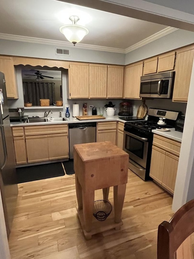 833 Winter Park Dr Unit 833, New Lenox, IL 60451 - kitchen featuring stainless steel appliances, light brown cabinets, ornamental molding, light wood finished floors, and light countertops