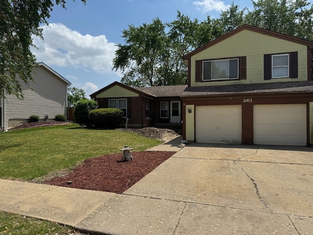 261 Bryant Way, Bolingbrook, IL 60440 - view of front of home with a garage, a front lawn, and driveway