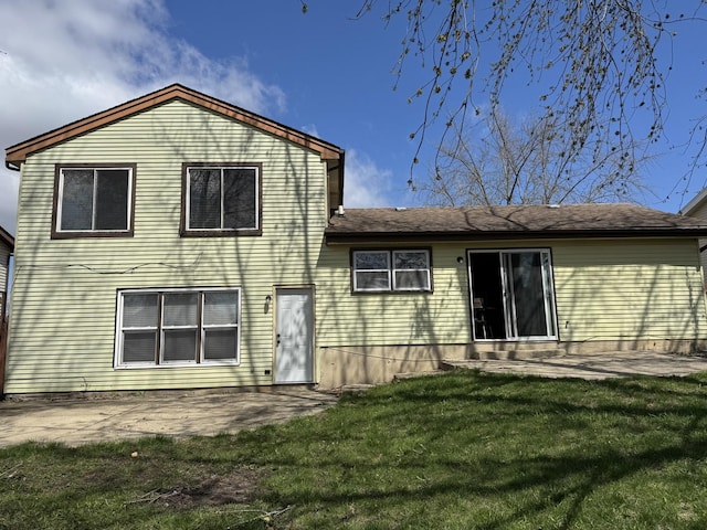 261 Bryant Way, Bolingbrook, IL 60440 - rear view of property featuring a lawn and a patio area