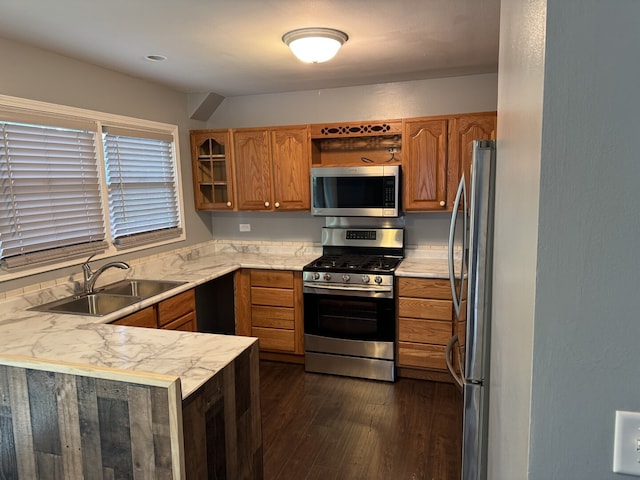 261 Bryant Way, Bolingbrook, IL 60440 - kitchen with stainless steel appliances, a peninsula, dark wood-style flooring, brown cabinetry, and glass insert cabinets