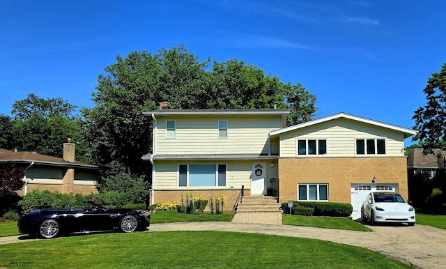 517 Appletree Ln, Deerfield, IL 60015 - split level home featuring brick siding, driveway, a garage, and a front yard