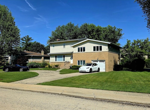 517 Appletree Ln, Deerfield, IL 60015 - split level home featuring driveway, an attached garage, a front yard, and brick siding