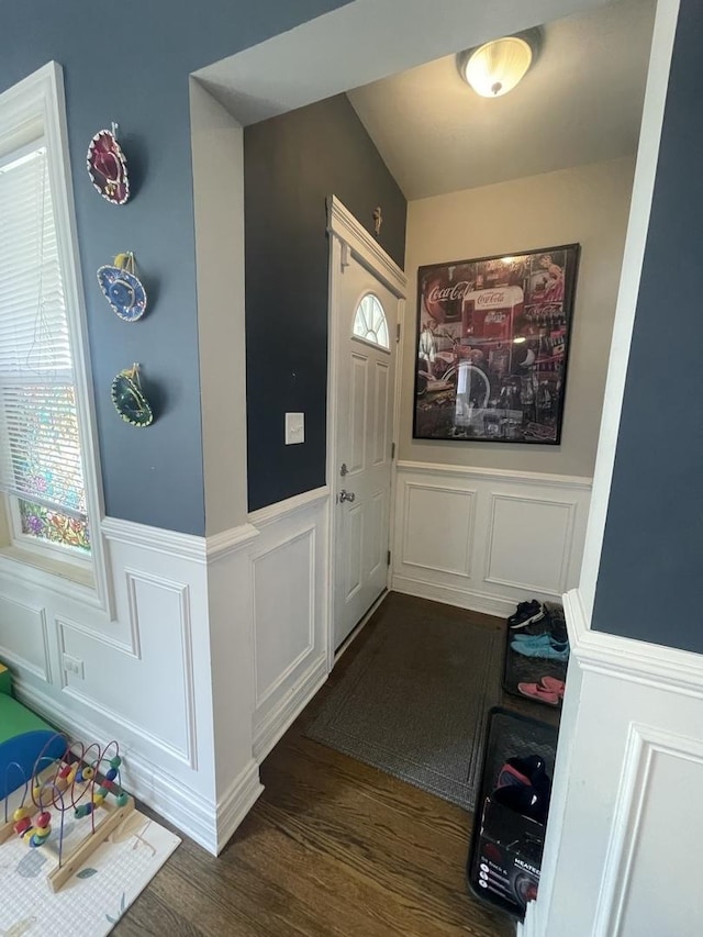 8233 S Manistee Ave, Chicago, IL 60617 - foyer featuring a decorative wall, dark wood-style floors, and a wainscoted wall