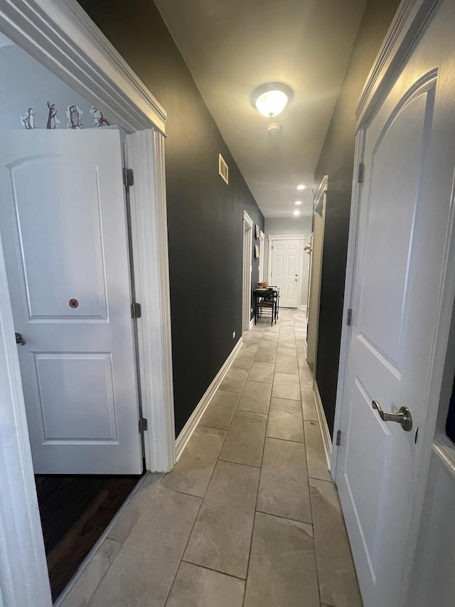8233 S Manistee Ave, Chicago, IL 60617 - hallway with baseboards and light tile patterned floors