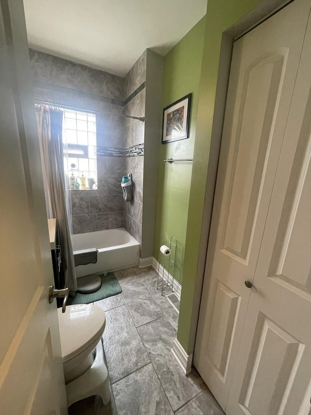 8233 S Manistee Ave, Chicago, IL 60617 - bathroom featuring toilet and shower / bath combo with shower curtain