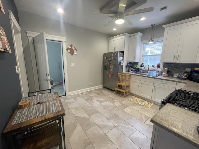 8233 S Manistee Ave, Chicago, IL 60617 - kitchen with stainless steel refrigerator with ice dispenser, ceiling fan, white cabinets, and recessed lighting