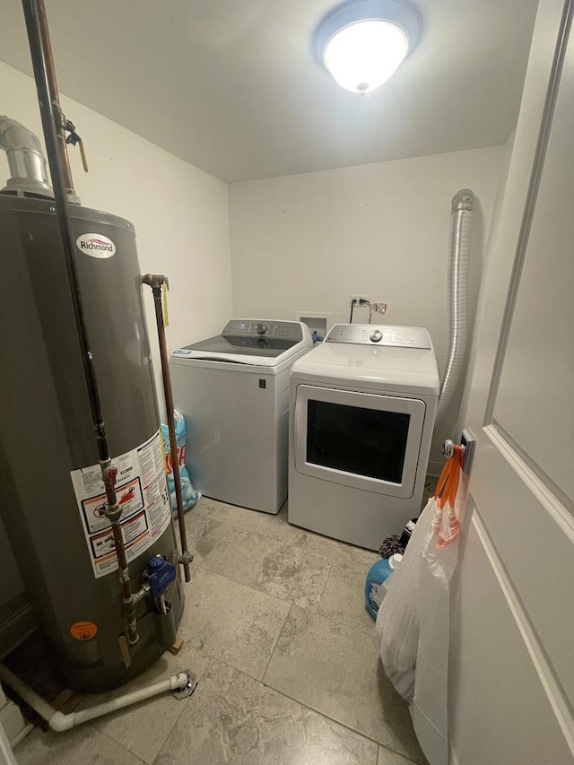8233 S Manistee Ave, Chicago, IL 60617 - laundry room featuring gas water heater, washer and clothes dryer, and light stone finish floors