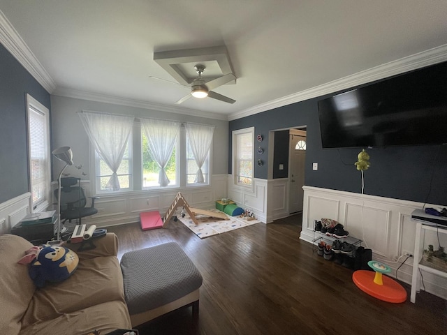 8233 S Manistee Ave, Chicago, IL 60617 - living area with dark wood-style floors, a ceiling fan, crown molding, a wainscoted wall, and a decorative wall