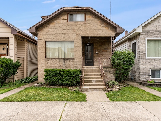 4923 W School St, Chicago, IL 60641 - view of front facade featuring stone siding
