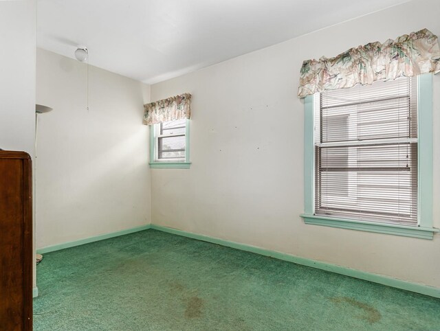4923 W School St, Chicago, IL 60641 - carpeted empty room featuring baseboards