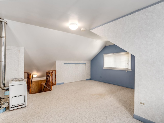 4923 W School St, Chicago, IL 60641 - additional living space with carpet floors and vaulted ceiling