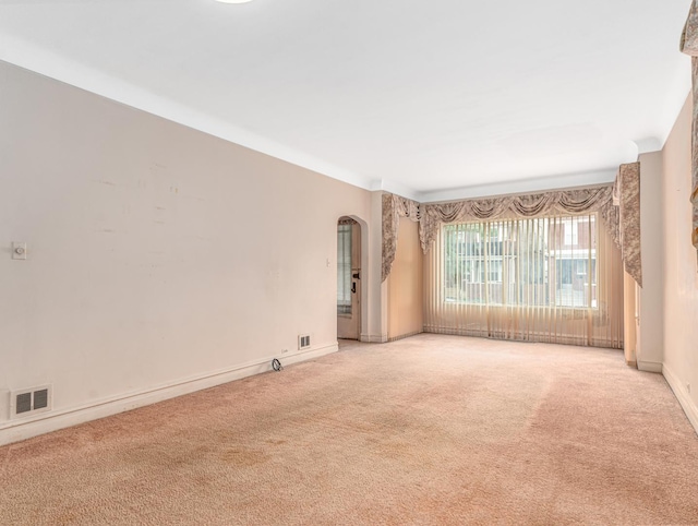 4923 W School St, Chicago, IL 60641 - carpeted empty room featuring arched walkways and baseboards