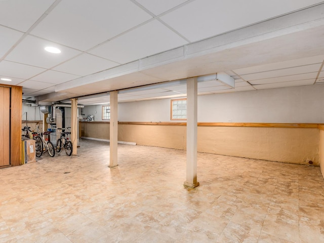 4923 W School St, Chicago, IL 60641 - basement featuring a paneled ceiling and tile patterned floors