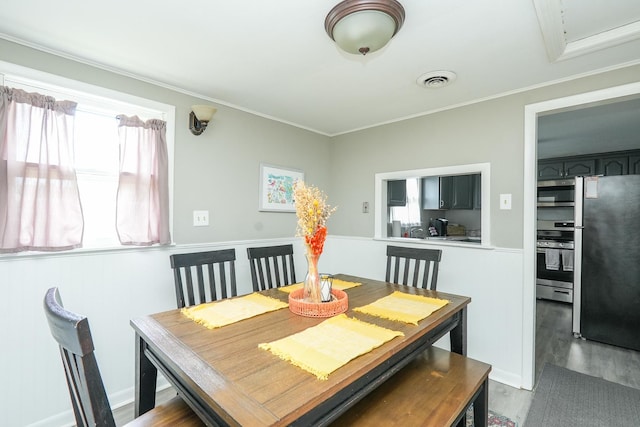 514 E Beaudoin St, Bourbonnais, IL 60914 - dining space featuring wood finished floors and crown molding