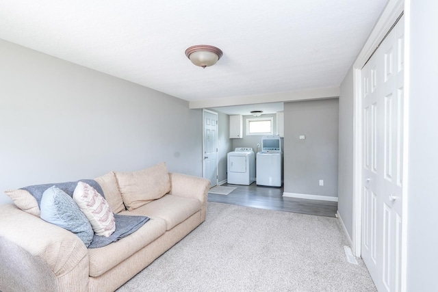 514 E Beaudoin St, Bourbonnais, IL 60914 - carpeted living room featuring washer and clothes dryer and baseboards