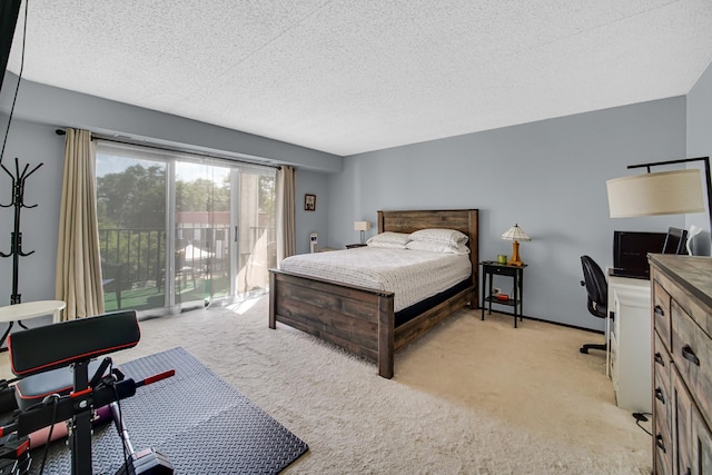 475 Plum Creek Dr Unit 212, Wheeling, IL 60090 - bedroom featuring access to exterior, light carpet, a textured ceiling, and an office area