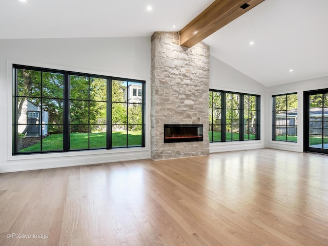 118 Lockerbie Ln, Wilmette, IL 60091 - unfurnished living room featuring beamed ceiling, high vaulted ceiling, wood finished floors, a fireplace, and recessed lighting