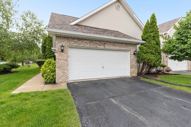 12050 Baneberry Dr Unit 9, Roscoe, IL 61073 - garage featuring driveway