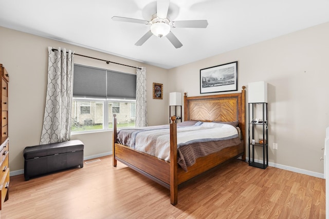 12050 Baneberry Dr Unit 9, Roscoe, IL 61073 - bedroom with light wood-style flooring and a ceiling fan
