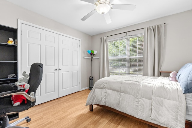 12050 Baneberry Dr Unit 9, Roscoe, IL 61073 - bedroom featuring wood finished floors, a closet, and a ceiling fan
